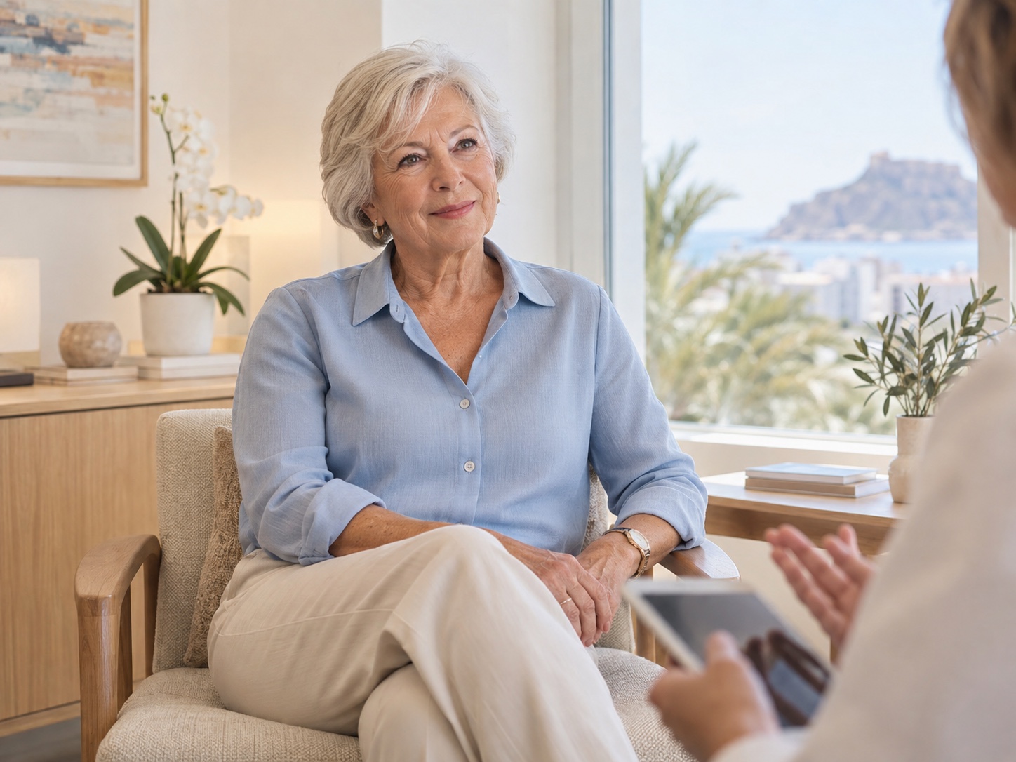 Mature British woman discussing breast reduction during a private consultation in Alicante